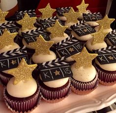 cupcakes decorated with gold stars and ribbons