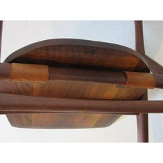 three wooden objects stacked on top of each other in the shape of an oar