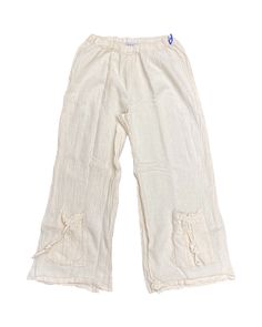 A popular, cotton gauze capri pant with a funky tie pocket detail at the bottom. Measurements 1 2 3 Waist Relaxed 24" 26" 30" Inseam 23" 23" 23" Cream Linen Pants With Pockets, Casual Beige Cotton Capris, Solid Color Capris With Pockets For Vacation, Vacation Capris With Pockets, Solid Capris With Pockets For Vacation, Relaxed Fit Capris With Pockets For Vacation, Spring Beach Cotton Capris, Wide Leg Capris With Pockets For Beach, Wide Leg Beige Cotton Capris