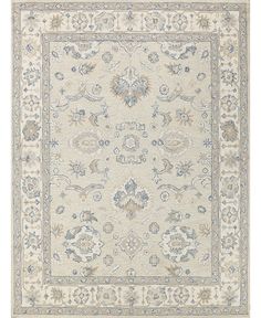 a beige rug with blue and white accents