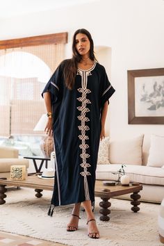 An elegant Moroccan caftan will make you feel like African royalty. It's extremely elegant with a dash of classy cotton embroidery in the front. Ideal for plus size women as well. Made of extremely soft fabric to make you feel free and beautiful at the same time.  This Kaftan is ideal to wear for any casual occasion. Whether taking a trip down the shopping lane, or home-based kitty parties, or about anything else, wearing this dress will make you feel classy and comfortable. Fabric : 70% Egyptia Oversized Cotton Kaftan, Black Cotton Short Sleeve Kaftan, Oversized Tunic Abaya, Beach Kaftan With Chikankari Embroidery, Black Bohemian Cotton Kaftan, Black Cotton Bohemian Kaftan, Cotton Tunic Kaftan For Eid, Free Size Tunic Abaya, Long Embroidered Free Size Kaftan