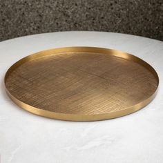 Round, hand-etched brass trays in an antique brass finish. Ideal for serving or displaying. Also available in antique nickel. Dimensions Overall 1.25"H x 22"Dia. (7.3 lbs)  Antique Brass Hand wash  Product is Food Safe Gold Flatware, Candle Wall Decor, Organization Furniture, Sterling Silver Flatware, Brass Tray, Vanity Decor, Global Views, Silver Flatware, Stainless Steel Flatware