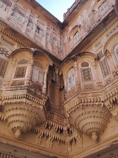 an intricately carved building with multiple balconies