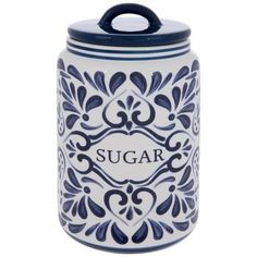 a blue and white sugar jar with the word sugar on it