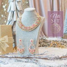 Giving out an elegant vibe owing to its sparkling stone mix! A versatile set encrusted with nauratan/CZ stones and pearl moti. The set includes a pair of beautiful earrings. Approximate earrings length is 4" Gold-plated on high-quality brass as base metal. Niti Set (CZ) is in-stock & ready-to-ship. Delivery time frame for Niti Set (Nauratan) is 4-6 weeks. For custom or urgent requests, please contactsupport@alacouture.com. Please Note: We use faux stones and beads in all of our jewelry. Elegant Pearl Jewelry Set For Gift, Dazzling Jewelry Sets With Sparkling Stones For Festivities, Elegant Pink Gift Sets, Elegant Kundan Jewelry Sets With Stones, Traditional Bridal Necklace With Sparkling Stones As A Gift, Bollywood Style Cubic Zirconia Jewelry Sets For Gift, Festive Sparkling Stones Jewelry For Gift, Festive Sparkling Stones Jewelry Gift, Elegant Stone Work Sets For Gift