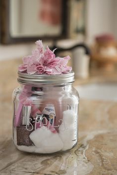 a mason jar filled with baby's breath flowers and personalized items is featured in this postcard