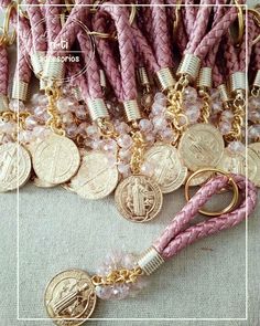 pink and gold bracelets with coins on them