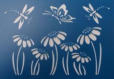 some white flowers and butterflies on a blue background