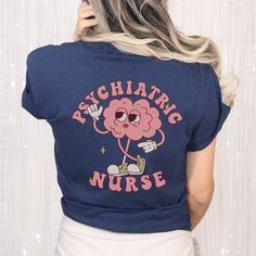 This retro Psychiatric Nurse shirt, / Psych Nurse Tshirt is cute and soft! Perfect gift for the Psychiatric Nurse~ **FRONT & BACK PRINT**  **UNISEX SIZING**  Click here to return to our shop's home page ⇒ https://www.etsy.com/shop/SketchyCatDesigns ♥ W E L C O M E  T O  S K E T C H Y  C A T  D E S I G N S ! ♥ Click here to return to our shop's home page ⇒  https://www.etsy.com/shop/SketchyCatDesigns All of our products are printed with eco-friendly water-based inks, giving them the softest feel. Novelty Long Sleeve Cotton Tops, Novelty Cotton Long Sleeve Tops, Cotton Novelty Long Sleeve Tops, Cute Shirt With Funny Print And Crew Neck, Cute Crew Neck Shirt With Funny Print, Novelty Blue Cotton Tops, Novelty Relaxed Fit Short Sleeve Tops, Cute Relaxed Fit Shirt For School, Blue Cotton Novelty Top