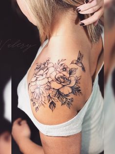 a woman with a flower tattoo on her shoulder