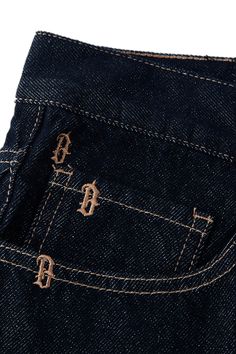 The Monogram Denim Shorts perfectly blend street style with meticulous craftsmanship. These slightly oversized shorts feature a regular embroidered pattern of the brand's initial "B," adding a distinctive and stylish touch. The back waistband is adorned with a custom brand leather patch, enhancing their unique appeal. Made from premium denim fabric (10.6 ounce/m²), these five-inch shorts offer both durability and comfort, making them an ideal choice for any casual look. Regular embroidered patte Embroider Denim, Oversized Shorts, Initial B, Shorts Design, Monogram Outfit, Knit Logo, 자수 디자인, Denim Branding, Embroidered Denim