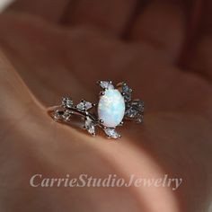 Vintage sterling silver white Opal ring, beautiful promise ring, unique birthday or anniversary gift. Materail: 925 Sterling Silver Main Stone: 6*8 mm Lab Opal Cut: Oval Side stone: CZ CS0466 ✈Free Shipping; 🎁Packaed with beautiful ring box; ★ 30 days return plicy; 🌺Custom service: 👉Stones can be different color, please contact for a custom request; 👉Can also customize with solid gold; 👉Engraving available; Home page:  https://www.etsy.com/shop/CarrieStudio Dainty White Sterling Silver Diamond Ring, Elegant White Sterling Silver Birthstone Ring, Dainty White Flower Ring For Promise, Dainty White Flower Promise Ring, Sterling Silver Diamond White Opal Promise Ring, Sterling Silver Opal Promise Ring In Diamond White, White Gemstone Diamond Ring In Sterling Silver, White Sterling Silver Cluster Ring With Gemstone, White Sterling Silver Diamond Ring With Gemstone