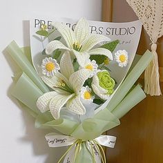 a bouquet of white flowers sitting on top of a table