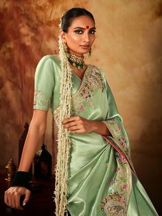 Sensible colors and excellent designs and romantic moods are reflected with an alluring style. Steal the hearts away with this Light Green Embroidered Work Silk Saree. This attire is beautifully adorned with embroidered, sequins and weaving work. Comes with matching blouse. This product consists of ready stitched blouse. Designs, colors and patterns on the actual product may slightly vary from designs shown in the image. Images are only representative. Stone Embroidery, Wedding Sarees Online, Kanjivaram Saree, Sea Green Color, Stitch Clothes, Bridal Lehenga Choli, Embroidery Saree, Style Steal, Saree Trends