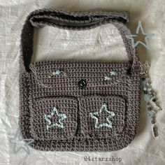 a crocheted purse with stars on it