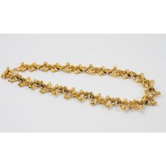 This is part of Chairish’s Costume Jewelry assortment.  Lovely French designer Guy Laroche Paris choker necklace. Dimensional brutalist shape, with gilt metal all textured. Toggle closing clasp. Signed underside near clasp "Guy Laroche - Paris." Measurements: 19.69 in long (50 cm) x 0.88 in wide (2.2 cm).  Please see the measurements noted above in the description for the best approximate dimensions. Luxury Gold Evening Choker, Luxury Gold Choker For Evening, Yellow Gold Metal Chain Necklace For Evening, Yellow Gold Chain Necklace For Evening, Gold Evening Jewelry With Clasp, Gold Jewelry With Clasp For Evening, Gold Costume Jewelry Choker For Evening, Evening Jewelry With Lobster Clasp, Gold Jewelry With Lobster Clasp For Evening