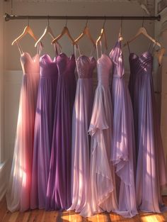 there are many dresses hanging on the rack