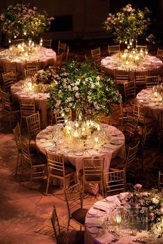 tables and chairs are set up with lit candles