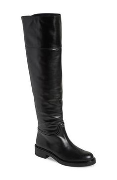 A classic riding boot takes a dramatic turn with smooth leather composition and an over-the-knee silhouette. 1 3/4" heel 20 1/2" shaft; 14" calf circumference Pull-on style Leather upper/synthetic lining and sole Made in Spain Classic Riding Knee-high Boots Medium Width, Elegant Wide Calf Knee-high Riding Boots, Elegant Wide Calf Knee-high Boots For Riding, Elegant Knee-high Riding Boots, Classic Wide Calf Knee-high Boots For Riding, Riding Knee-high Boots With Leather Sole, Elegant Wide Calf Riding Boots, Elegant Leather Sole Knee-high Boots For Riding, Elegant Over The Knee Workwear Boots