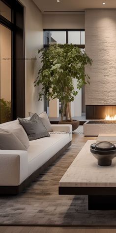 a modern living room with white couches and a fire place in the center area