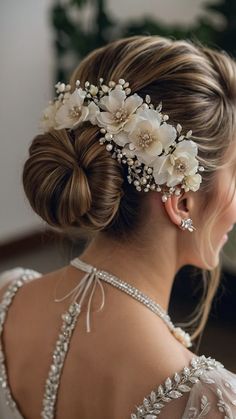 Discover the most enchanting bridal floral bun hairstyles wedding inspiration including elegant ponytail low bun fancy ponytail down high ponytail side swept side-d hairband styles Whether you prefer an open or a closed hairstyle on your special day we've got you covered with breathtaking hair ideas to enhance your wedding look