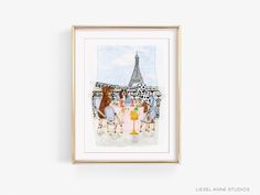 a painting hanging on the wall next to a white wall with a gold frame and an eiffel tower in the background