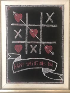 a chalk board with hearts and crosses drawn on it, says happy valentine's day