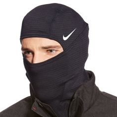 Convertible foldover design with eye opening for optimal visibility Therma-Sphere fabric with Dri-FIT technology delivers moisture wicking Balaclava style offers comfort and protection for external elements Nike Swoosh logo graphic above eye and reflective vertical stripe in the back Winter Windproof Nylon Activewear, Black Sports Balaclava With Fleece Lining, Black Winter Activewear For Sports Events, Black Fleece-lined Balaclava For Sports, Black Windproof Activewear For Sports, Black Windproof Activewear For Winter, Black Windproof Winter Activewear, Black Hooded Balaclava For Sports, Sports Balaclava With Adjustable Hood