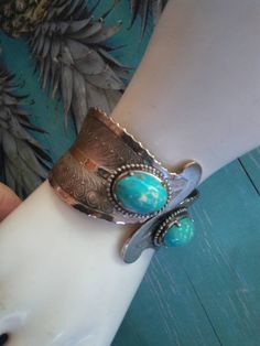 ON SALE Very pretty silvertone metal wide faux turquoise clamper bracelet in wonderful vintage condition. Looks very pretty on the wrist. Measures almost 2 in wide in the front by approximately 7 in round. Bohemian Turquoise Metal Cuff Bracelet, Turquoise Metal Bangle Cuff Bracelet, Handmade Turquoise Metal Cuff Bracelet, Unique Nickel-free Turquoise Cuff Bracelet, Unique Turquoise Nickel-free Cuff Bracelet, Antique Turquoise Adjustable Bracelet, Antique Adjustable Turquoise Bracelet, Silver Bohemian Cuff Bracelet With Patina, Bohemian Silver Cuff Bracelet With Patina