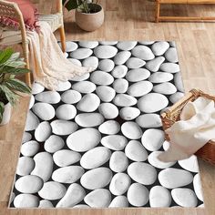 a rug with white circles on it in a living room next to a chair and potted plant