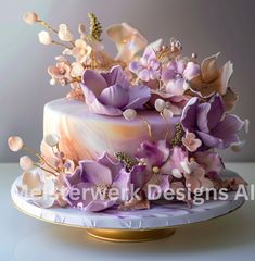 a cake decorated with purple flowers and leaves