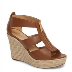 The Damita Platform Sandals Are The Ultimate Summer Wedge. The Heel Is The Perfect Height And The Lightweight Fabric Comes In Super Cute Colors. The Zipper Detail Along The Front Provides The Chic And Glamorous Touch That Michael Kors Is Known For. 3-3/4" Espadrille Wedge Heel, 1" Platform, Feels Like 2-3/4" Heel Round Open-Toe Platform Wedge Sandals With Zipper Color: Brown Size: 10 New With Box Michael Kors Brown Sandals For Summer, Chic Michael Kors Sandals For Vacation, Michael Kors High Heel Platform Wedge Sandals, Michael Kors Brown Wedge Heel Sandals, Michael Kors Leather Wedge Sandals For Vacation, Michael Kors Wedge Heel Sandals For Summer, Michael Kors Wedge Heel Sandals For Spring, Michael Kors Open Toe Wedge Sandals For Summer, Michael Kors Summer Wedge Heel Sandals