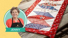 a woman sitting on top of a wooden bench next to a quilted table runner