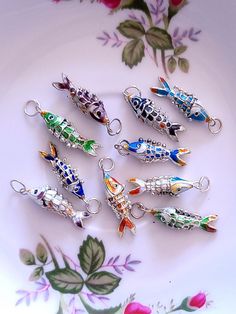 US orders $35 and up ships free, automatically applies at checkout Type: Handcrafted Cloisonne Enamel Koi Fish Charms Size: approximately 1 inch to 1.25 inches including the ring QTY: available single piece or 5 pieces/pack or 10 pieces/pack Most items will ship within 1-3 business days. Please feel free to message me if you have any questions! Thank you! :) Cloisonne Enamel, Funky Jewelry, Jewelry Show, Koi Fish, Jewelry Patterns, Key Chains, Cute Jewelry, Shop Decoration, Single Piece