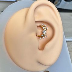 a close up of a fake ear with a ring on it