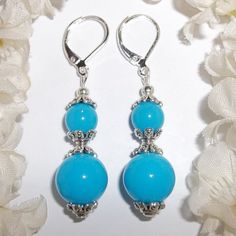 Turquoise Blue Statement Earring Handmade Beaded Silver Set Dangle Drop 4693 This Cute Beaded Costume Jewelry Earring Set Is Brand New And Handmade By Me - Wvluckygirl. Handcrafted With Turquoise Blue Acrylic Beads. The Pair Also Have Silver Toned Costume Jewelry Beads That Were Antiqued In Black. They Dangle & Drop From 925 Sterling Silver Lever Backs For Women's Pierced Ears. Measure 2 Inches Tall & 1/2 Inch Wide. Each Single Earring Weighs 2.5 Grams. Perfect Fashion Accessory For When You Nee Turquoise Earrings With Silver Beads, Blue Drop Earrings With Silver Beads, Light Blue Beaded Dangle Jewelry, Blue Earrings With Silver Beads, Light Blue Drop Earrings With Dangling Beads, Hypoallergenic Blue Beaded Earrings, Elegant Light Blue Beaded Dangle Earrings, Nickel-free Light Blue Round Bead Jewelry, Elegant Turquoise Beaded Earrings For Gift