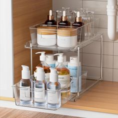 a bathroom shelf filled with bottles and soaps