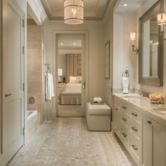 a large bathroom with two sinks and a bathtub