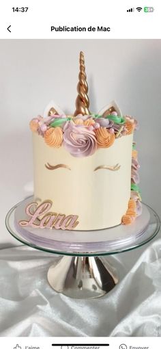 a birthday cake decorated with an unicorn's horn