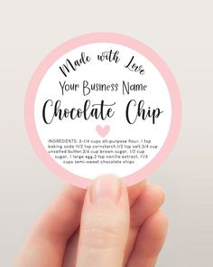 a person holding up a chocolate chip in front of a white background with the words made with love on it