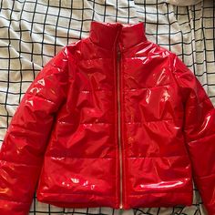 Red Raincoat Like Material Puffer Jacket With Gold Zipper. Never Worn Red Hooded Outerwear With Zipper, Red Hooded Outerwear With Zipper Closure, Red Winter Outerwear With Zipper, Red Winter Outerwear With Zipper Closure, Red Puffer Jacket With Zipper For Fall, Red Puffer Jacket With Zipper Closure For Fall, Red Winter Puffer Jacket With Zipper, Red Hooded Outerwear For Fall, Trendy Red Outerwear For Fall