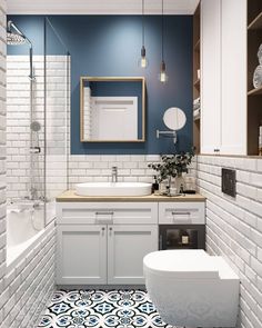 a bathroom with blue and white tiles on the floor, sink, toilet and bathtub