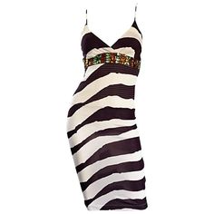 Amazing vintage GIANFRANCO FERRE (early 90s) brown and white abstract zebra printed rayon jersey BodyCon dress! Features incredible Amber and green crystal jewels below bust. Intricate stitching below bust. Hidden zipper up the side with hook-and-eye closure. Such a flattering little dress, that is a tru stunner on! Rare limited edition piece, that was made in Italy for the Japanese market only! Great for any day or evening event. Perfect with sandals, wedges, boots or heels. In great condition. Made in Italy. Marked Size EU 38 Measurements: (lots of stretch) 32-38 inch bust 26-30 inch waist 34-42 inch hips 41 inches from top shoulder to hem Green Velvet Gown, Brown Bodycon Dress, White Jersey Dress, Blue Knit Dress, Runway Gowns, White Vintage Dress, Designer Maxi Dress, Zebra Print Dress, Cocktail Dress Vintage