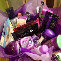 a purple bag filled with lots of beauty products