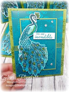 a handmade card with a peacock on it