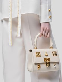 [vc_row][vc_column width=”1/3″][vc_column_text text_larger=”no”] Schiaparelli Schiaparelli Mini Bijoux Secret Bag This mini handbag is made of smooth ecru lambskin leather. Elegant Beige Bag With Lock, Luxury Gold Shoulder Bag With Lock, Gold Evening Shoulder Bag With Lock, Elegant White Bag With Turn-lock Closure, Gold Bag With Turn-lock Closure For Everyday Luxury, Designer Gold Shoulder Bag With Turn-lock Closure, Elegant White Bag With Lock, Luxury Cream Shoulder Bag For Evening, Elegant White Bags With Lock