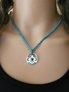 Thunderbird Necklace. Blue Glass Beads, Zinc Alloy Thunderbird Pendant with One Turquoise Bead In the Center. 21mmX21mm Pendant. Thunderbird Necklace, Necklace Blue, Turquoise Beads, Blue Glass, Pendant Necklaces, Zinc Alloy, Favorite Jewelry, Nativity, Native American