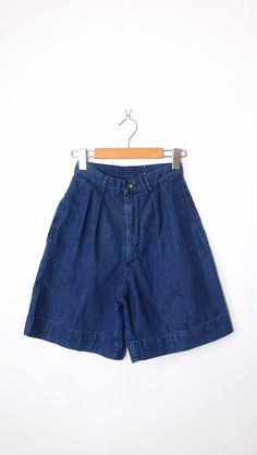 "Vintage High Waisted Denim Shorts/Pleated Denim Shorts. Measurements Total Length  : 19\" Waist              : 22\" Hips                : 36\" Inseam           :  7 \" Rise                 : 13\" Condition      : Gently used. There`s no stains or holes. Good condition. ※Please read the policy before you purchase※" Denim Wide Leg Bermuda Shorts With Pockets, Wide Leg Denim Bermuda Shorts With Pockets, Medium Wash Wide Leg Cotton Jean Shorts, Medium Wash Wide Leg Jean Shorts, Wide Leg Medium Wash Cotton Jean Shorts, Medium Wash Cotton Jean Shorts With Belt Loops, High Waist Denim Blue Bermuda Shorts, High-waisted Denim Bermuda Shorts In Blue, Dark Wash Relaxed Fit Bermuda Cotton Shorts