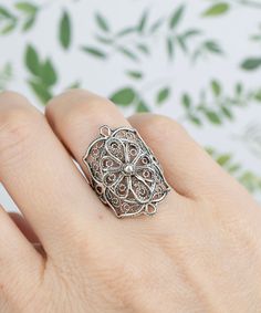 This 925 Sterling Silver Filigree Art Embroidery Detailed Women Cocktail Ring is a true masterpiece. Each ring is carefully handcrafted by skilled artisans using high-quality 925 sterling silver, resulting in a unique and elegant piece of jewelry.  The ring features intricate filigree work that showcases a lace design, adding a touch of femininity and elegance to the piece. The ring has a solid silver long and bold design, making it a statement piece that will surely turn heads.  Perfect for any Bohemian Engraved Ring As A Gift, Bohemian Engraved Ring As Gift, Heirloom Silver Filigree Ring With Intricate Design, Heirloom Filigree Engraved Ring As Gift, Heirloom Engraved Filigree Ring As Gift, Heirloom Filigree Engraved Ring Gift, Heirloom Engraved Filigree Ring Gift, Antique Filigree Engraved Ring As Gift, Bohemian Sterling Silver Filigree Ring For Wedding