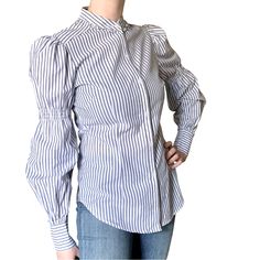 This Max Stufio Pinstripe Blouse Is Nwt And So Flattering! There Is A Stretchy Smocking On The Sleeve For A Puffy Effect And Also Some Mini Ruffles Around The Mandarin Collar. Modeled On A Size 6-8; Best For 6 Or Under Chest Approximately 18 Inches; 28.5 Length Chic Blue Blouse With Striped Collar, Spring Striped Puff Sleeve Tops, Spring Pinstripe Blouse With Striped Collar, Striped Blouse With Puff Sleeves, Daywear Striped Blouse With Striped Collar, Chic Pinstripe Blouse With Striped Collar, Spring Office Tops With Vertical Stripes, Fitted Striped Blouse With Ruffles, Elegant Striped Cotton Blouse